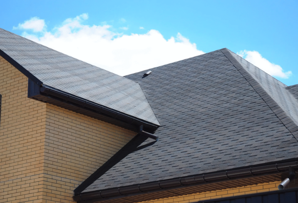 A brick house with a full solar panel on the roof